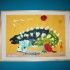 Ankylozaur na tle wulkanu&#45; zrobiony przez mojego 5letniego syna Damiana&#40;wielkiego miłośnika dinozaurów&#41;, przy użyciu farb, kredek, brokatów i wycinanek na kartce formatu 60x80cm,od razu musiał trafić do ramki i na ścianę:&#41;